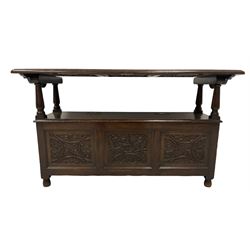 18th century design oak monks bench, the metamorphic top carved with three faux panels depicting scrolling foliate and seahorse motifs, over box seat with hinged lid, the front panels carved with foliate lunettes