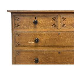 Victorian Aesthetic Movement scumbled pine chest, rectangular top with moulded edge, decorated with painted ebonised stringing and banding, fitted with two short over three long graduating drawers, the facias painted with stringing and stylised foliate decoration, each with ebonised turned handles