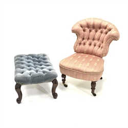Victorian walnut framed deep buttoned salon chair, upholstered in pink floral fabric, raised on turned front supports and castors, (W54cm) together with a 20th century walnut framed footstool, upholstered in buttoned blue velvet, raised on floral carved cabriole supports, (65cm x 44cm, H32cm)