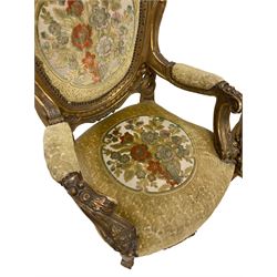 Pair mid-20th century gilt wood armchairs, the cresting pierced and carved with c-scrolls and foliate, upholstered in floral pattern fabric with raised decoration, floral carved arm terminals and uprights, the apron carved with shell