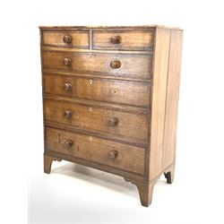 Georgian oak chest, fitted with two short and four long graduated drawers with mahogany bands, raised on bracket supports W98cm, H119cm, D46cm
