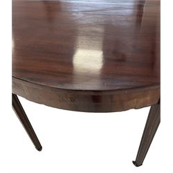 George III mahogany dining table, raised on square tapering supports, terminating in brass castors 