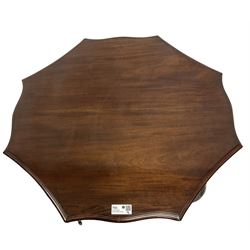 Early 20th century mahogany centre table, shaped octagonal top with moulded edge, cabriole supports with castors united by undertier