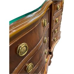 Pair of Georgian style yew wood serpentine bedside chests, shaped plate glass top over four drawers, raised on bracket supports W41cm