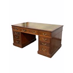 Victorian mahogany partners desk, the top with inset tooled green leather writing surface and carved moulding to edge, one long drawer to centre and two banks of four graduated cock beaded drawers opposite two cupboards, raised on castors 152cm x 90cm, H80cm