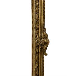 19th century giltwood and gesso wall mirror, the rectangular frame decorated with trailing fruiting foliage and C-scroll foliage cartouche corner brackets, plain mirror plate