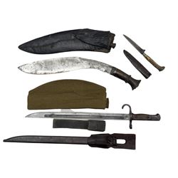 Japanese World War II bayonet with metal scabbard and leather frog, Nepalese Kukri, German knife with stag horn handle and sheath by Leykauf and a military forage cap