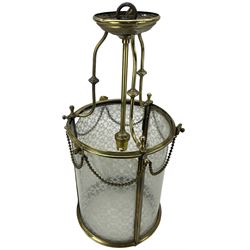 Edwardian cylindrical gilt brass hall lantern, with four etched glass panels and beaded swags suspended from flower head terminals, H50cm x D25cm 