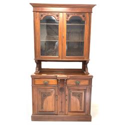 Edwardian walnut sideboard, the raised back fitted with two glazed doors enclosing three adjustable shelves, over a bevelled mirror, two drawers and two cupboards W120cm, H227cm D50cm