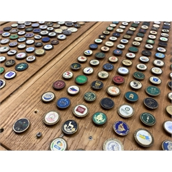  Large collection of Golf ball markers mounted on oak panels, 55cm x 23cm  