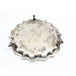 Small silver circular salver with piecrust border and triple shaped supports D20cm marks rubbed but maker Elkington & Co.11.7oz