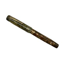 Parker, Duofold Lucky Curve, a green and brown marbled fountain pen, the cap with a gilt clip and triple cap band, button filling system and 18ct gold nib
