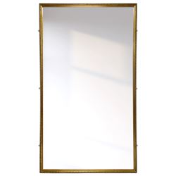 Large gilt framed rectangular mirror, the frame decorated with stylised foliate band and beaded inner slip, plain mirror plate 
Provenance: From the Estate of the late Dowager Lady St Oswald
