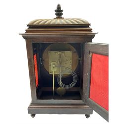 Winterhalder and Hoffmeier striking mantle clock in a mahogany case with a carved gadrooned top surmounted by a turned wooden finial, with applied brass decoration, inlay and silk backed sound frets, circular silvered dial with Roman numerals, minute track and steel hands (minute hand replaced) with a convex glass and brass bezel, twin eight-day going barrel movement striking the hours and half hours on a coiled steel gong. With Pendulum.  
Winterhalder and Hoffmeier were one of the leading German clock manufacturers of the 19th and early 20th century from 1850 to1933.



