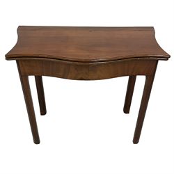 George III mahogany serpentine fronted tea table, shaped fold-over top with moulded edge, over double gate-leg action base, raised on square moulded supports with inner chamfer
Provenance: From the Estate of the late Dowager Lady St Oswald