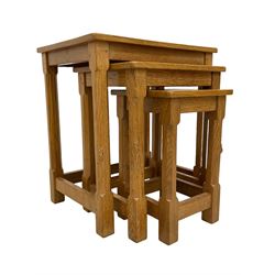 Mouseman - nest of three oak occasional tables, rectangular adzed tops on octagonal supports, each carved with mouse signature, by the workshop of Robert Thompson, Kilburn 