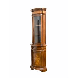 Late 20th century continental style walnut corner cabinet, the boxwood inlayed frieze over glazed door encompassing two shelves,  two cupboards under H220cm, W75cm, D50cm