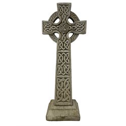 Composite stone Celtic Cross garden ornament, the central tree of life motif within the interlaced nimbus, the arms and stem enclosing celtic knots, raised on stepped base