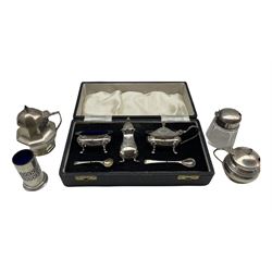 Silver three piece condiment set in case Sheffield 1964, two silver mustard pots, glass and silver mustard pot and a silver tooth pick holder with blue glass liner