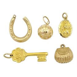 Two gold 21 key and St Christopher charms by Georg Jensen and three other gold charms including purse, horseshoe and football, all 9ct