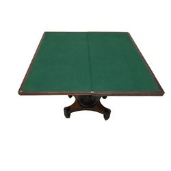 William IV rosewood card table, the rectangular hinged swivel top revealing green baise inset with crossbanding, the lappet carved pedestal and collar terminating in a concave sided quadripartite platform, raised on turned feet with brass castors