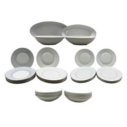 Jasper Conran for Wedgwood, a part dinner service comprising twelve dinner plates, eleven bowls, six side plates and oval platter, all with silvered rims, together with six striped side plates, oval platter and two oval bowls 