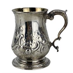 Early George III silver baluster mug with later embossed decoration and inscription, leaf capped scroll handle and gilded interior H12cm London 1764 Maker Benjamin Bickerton  