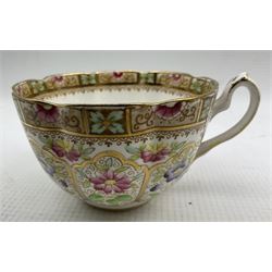 William Lowe part tea set comprising cups, saucers, plates and cake platter decorated with pink and blue flowers with gilt