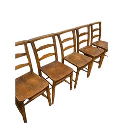 Set ten chapel chairs, the shaped elm seat raised on turned supports, united by stretchers