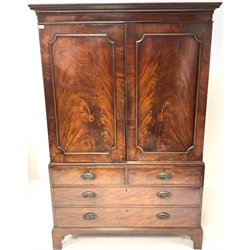 George III mahogany linen press with dentil cornice, the upper section with sliding trays and enclosed by panelled doors, two long and two short drawers under on bracket feet, W133cm, H202cm, D64cm