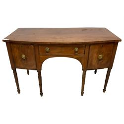 George III mahogany bow-front sideboard, fitted with cupboard and two drawers, on ring turned supports