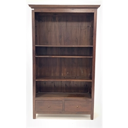 20th century stained hard wood open bookcase, with three adjustable shelves over two drawers, raised on square supports, W120cm, H201cm, D40cm