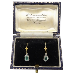 Pair of 9ct gold emerald and diamond cluster pendant earrings, boxed