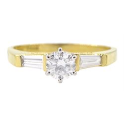 18ct gold round brilliant cut diamond ring, with tapered baguette diamond shoulders, London 2001, principle diamond approx 0.30 carat, total diamond weight approx 0.40 carat