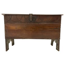 18th century oak coffer or chest, rectangular hinged top with moulded edge, the frieze carved with interlacing lunettes, raised on stile supports 
