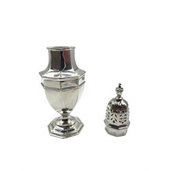 Edwardian silver panel sided vase shape sugar caster Birmingham 1908 maker John Round and a silver bottle coaster with pierced sides and turned wooden base Birmingham 2000 (2)