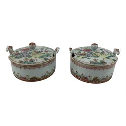 Pair of 18th century Chinese Export porcelain butter tubs and covers, enamelled in famille rose colours with exotic birds in a garden setting with peonies, chrysanthemum and branches of flowering prunus issuing from rockwork, withing iron red and gilt borders, L12.5cm (2) Provenance: From the Estate of the late Dowager Lady St Oswald