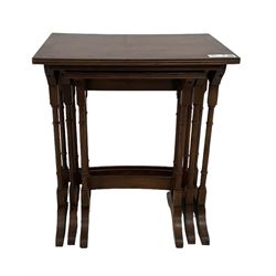 Early 20th century yew wood nest of three tables, rectangular ebony strung top with reeded edge, ring turned end supports with sledge feet