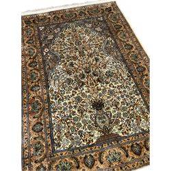 Persian Isfahan rug, the mihrab enclosing tree of life design with urn, all-over floral decoration, multiple band border with repeating design
