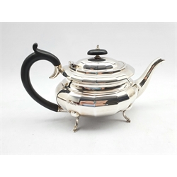 Silver oval teapot of panelled design with ebonised handle and lift on four splay feet Sheffield 1932 Maker Viners 20.2oz gross