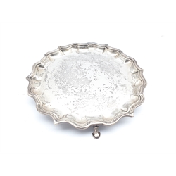 Small silver circular salver with piecrust border and triple shaped supports D20cm marks rubbed but maker Elkington & Co.11.7oz