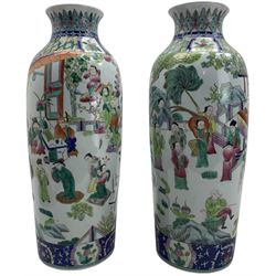 Pair of Chinese famille rose cylindrical sleeve vases, each decorated with a continuous scene of figures on a terrace, within geometric borders, H46cm Provenance: From the Estate of the late Dowager Lady St Oswald