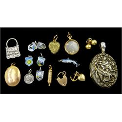 Pair of 18ct gold ball pendants, gold anchor, heart charms, locket and heart lock, all 9ct, gold charm stamped 14K, silver fish charm, silver locket pendant, with embossed Hindu God decoration by George William Dawson, Chester1882 and other silver items