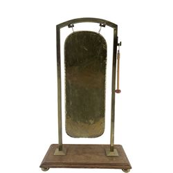 Early 20th century brass rectangular gong on oak platform base, H83cm