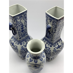  Pair of 20th Century Chinese blue and white vases decorated with flowers and with elephant head handles H46cm and another smaller blue and white vase  