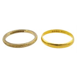 22ct gold wedding band and a 9ct gold wedding band, with engraved decoration, both hallmarked