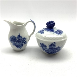  Royal Copenhagen cream jug and sucrier decorated with blue flowers within a basket weave moulded rims (2)  