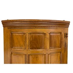 'Beaverman' oak bow front corner cupboard, moulded cornice over bowed panelled door, the upright carved with beaver signature, the interior fitted with three shelves, by Colin Almack of Sutton-under-Whitestonecliffe