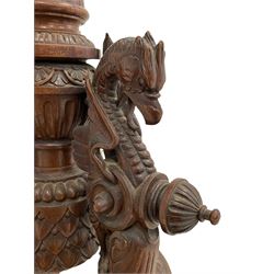 19th century walnut tripod stand, concave and canted square top with lobe carved rim, fluted column with scrolling acanthus leaf capital on platform, the platform of circular form carved with shells and surmounted by three dragon figures, three splayed scaled supports carved with acanthus leaves and with ball and claw feet, foliate swags and carved stylised flower head brackets