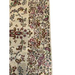 Persian Kerman cream ground rug, overall floral design, sparse field decorated with trailing flower head and Boteh motifs, repeating floral pattern border with repeating motifs